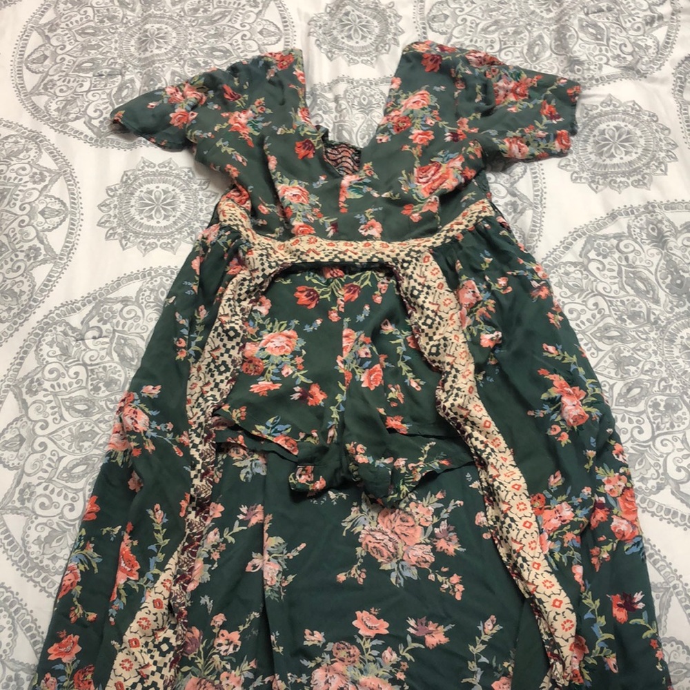 Romper with shorts and long cape.